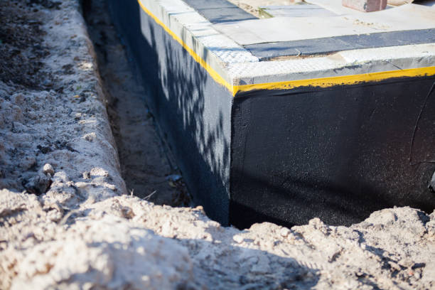 Professional Basement Waterproofing technician working in Montgomery, AL